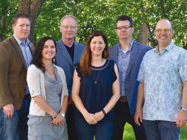 ft3's five Principles pose for a group photo in the park across the street from the office.