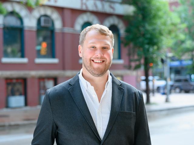 Adan Dubyna in front of a heritage building in the Exchange