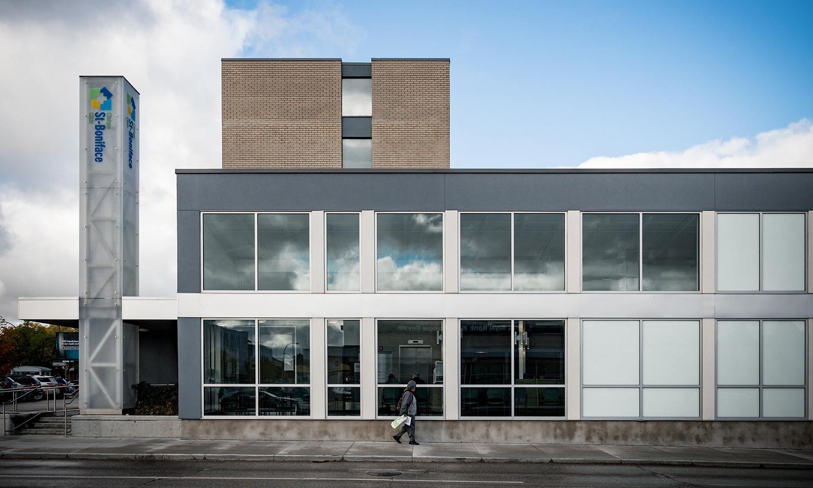 St Boniface Clinic. Side view of the exterior as seen from Tache, focusing on the large wall of side windows.